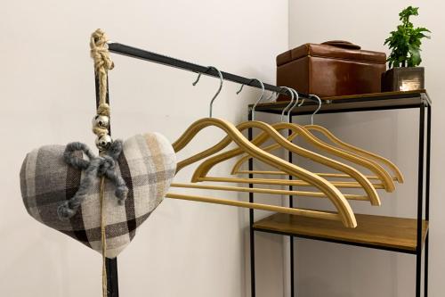 a lamp with a blanket hanging on a shelf at Locanda Vecchio Cipresso in Chiaverano
