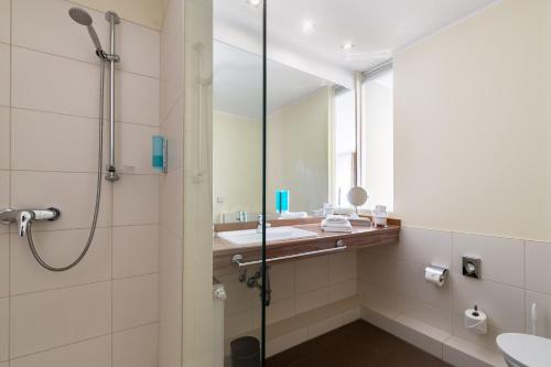 Koupelna v ubytování Hotel am Schlosspark garni