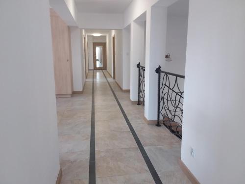 a hallway with a long mirror in a house at Dworek Akacja uslugi hotelarskie in Janowiec