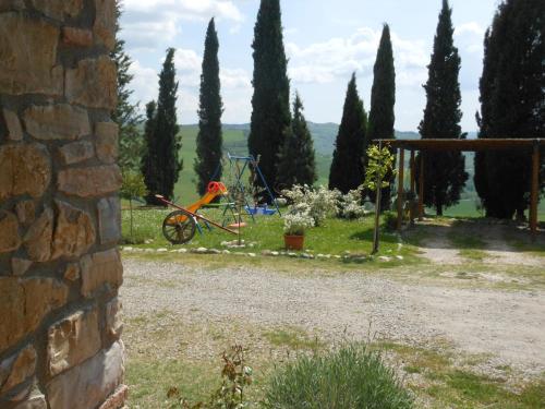 a garden with a playground and trees at Agriturismo Collomici in Celle sul Rigo