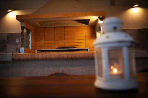 a close up of a lantern on a table in a kitchen at House on the beach in Salamina