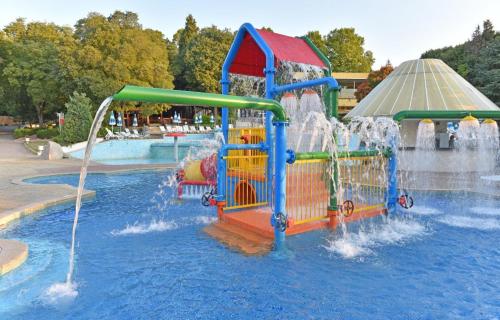 a water park with a slide in the water at Hotel Orhidea in Albena