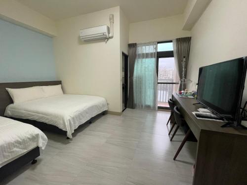 Cama o camas de una habitación en 昕田民宿