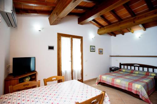 A bed or beds in a room at Residenza Le Tartarughe