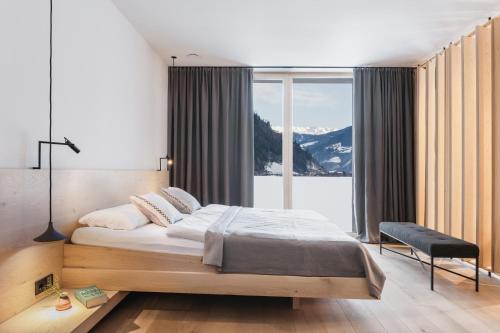 A bed or beds in a room at zelloon boutique hotel