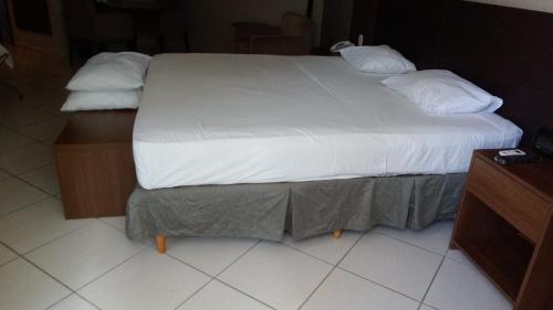 Cama o camas en habitación en Flat Recife Av Boa Viagem- Beach Class Internacional