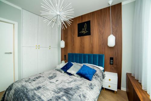 Tempat tidur dalam kamar di Apartament Gold - Racławickie 28a