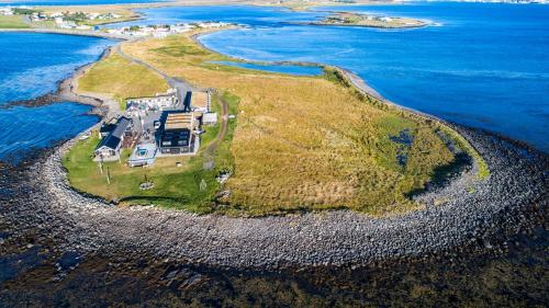 an aerial view of an island in the ocean at Hlid Fisherman's Village in Álftanes