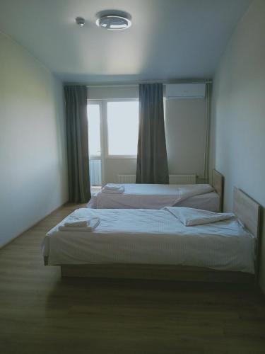 Una cama o camas en una habitación de Laguna