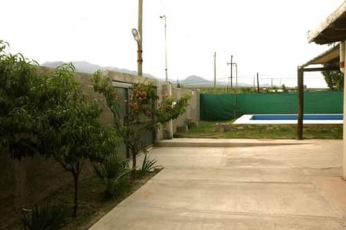a parking lot with a skate park in the background at LA MARIA in Ciudad Lujan de Cuyo