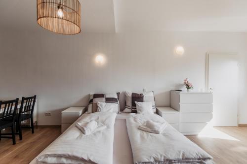 מיטה או מיטות בחדר ב-Ferienhaus Schilfvilla