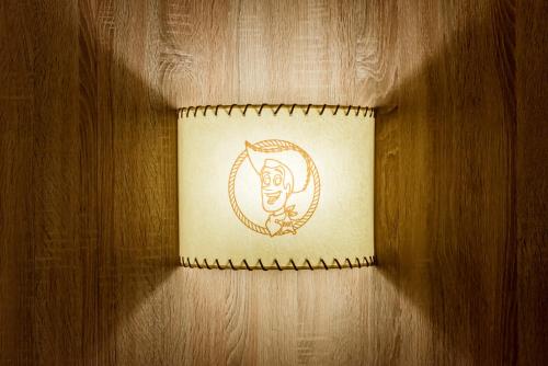 a drawing of a face on a paper on a wall at Disney Hotel Cheyenne in Coupvray