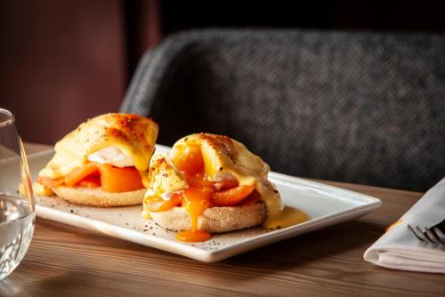two sandwiches on a plate on a table at The Clermont London, Victoria in London