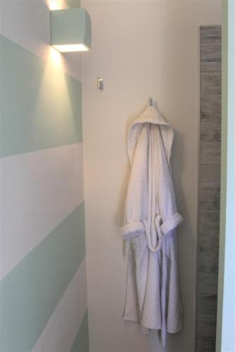 a towel hanging on a wall in a bathroom at La Bella Vite in Moncalvo