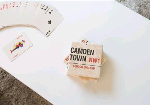 a pack of canadian town kiwi cards sitting on top of a paper at Deluxe Central London Camden in London