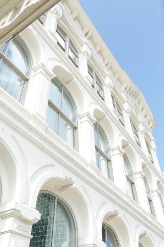 a white building with many windows on it at Capital Hotel in Little Rock