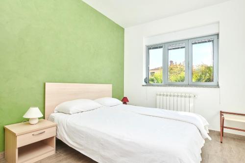 Postel nebo postele na pokoji v ubytování Apartments Ferlin