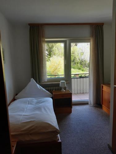 Säng eller sängar i ett rum på Gästehaus Endrich