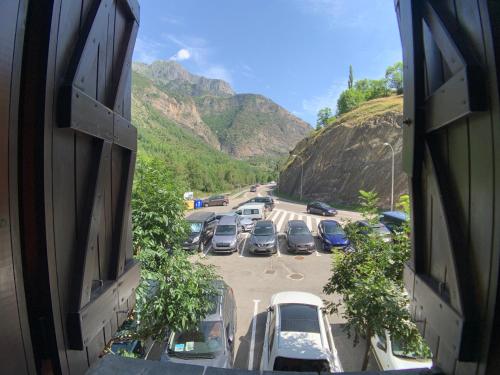 a bunch of cars parked in a parking lot at B36 - Mayor 48, 1º - Villmor in Benasque