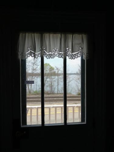 a window with a view of a train at The Burlington Hotel & Bar - Alma WI in Alma