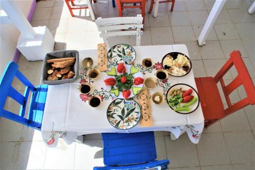 an overhead view of a table with plates of food at Lavender Otel in Cesme