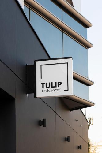 a sign on the side of a building at Tulip Residences Joinville-Le-Pont in Joinville-le-Pont
