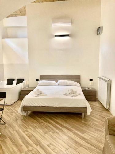 a bedroom with a bed with two towels on it at Pigneto Square Home in Rome