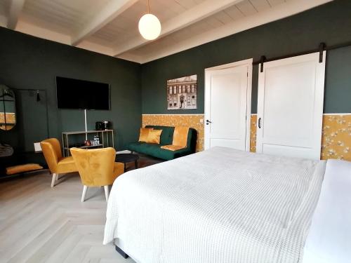 Postel nebo postele na pokoji v ubytování B&B De Stadssingel