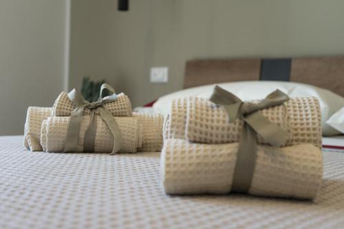 a group of pillows sitting on top of a bed at Green Land Boutique Hotel in Castilenti