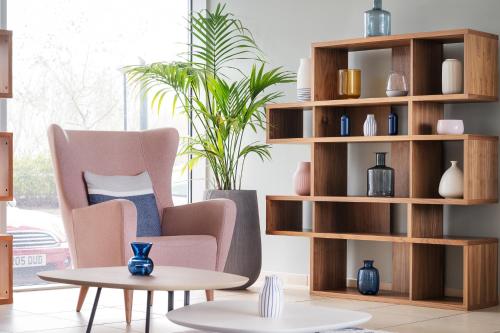 a living room with chairs and a coffee table at voco Reading in Reading