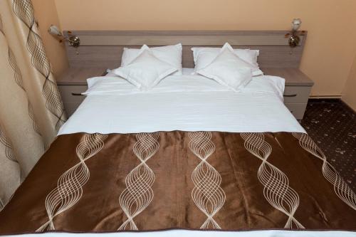 Кровать или кровати в номере Pensiunea Gabriel
