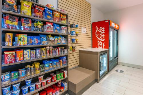 a store aisle with a cocacola soda machine at Holiday Inn Express & Suites - Phoenix Dwtn - State Capitol by IHG in Phoenix