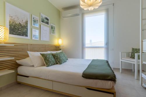 a bedroom with a large bed in a room at °° VILLA ANNA°° in Villasimius