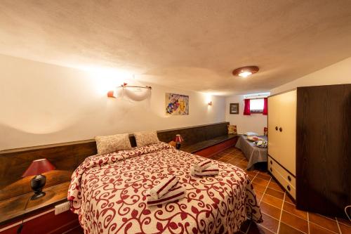 Ένα ή περισσότερα κρεβάτια σε δωμάτιο στο Tavernetta Apartment