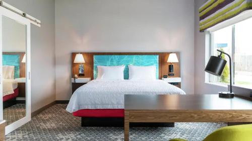 A bed or beds in a room at Hampton Inn Danville, Va