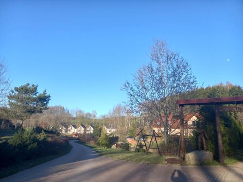 a view of a road with a wooden at DOMKI - Kaszuby Resort ZACISZE - new cottage in Chmielno