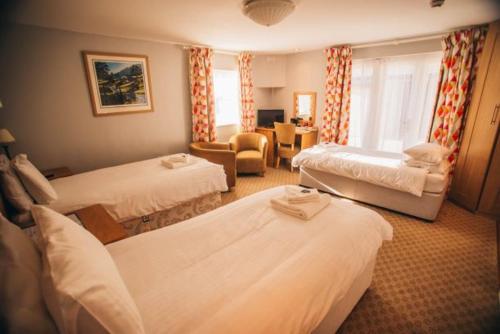 Postel nebo postele na pokoji v ubytování Tynycornel Hotel