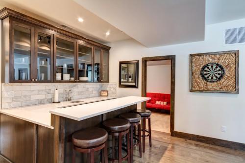 a kitchen with a counter and bar stools at Default in Breckenridge