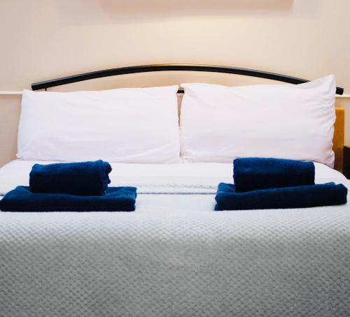 A bed or beds in a room at The Boathouse 