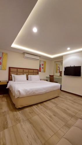 Llit o llits en una habitació de Sea Club Resort