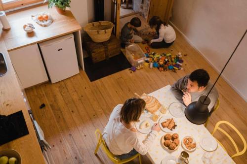 a group of people sitting at a table with food at Ca lEspavil in Cardedeu