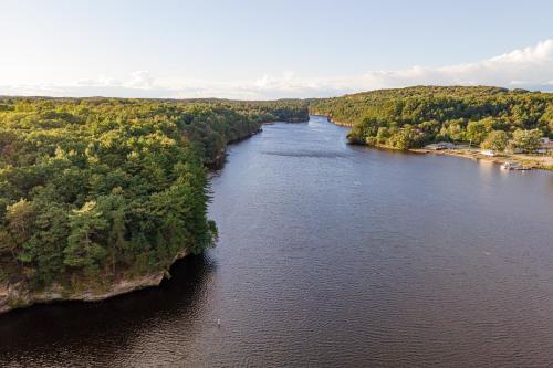 an aerial view of a river with trees on both sides at White Rose Inns & Motel in Wisconsin Dells