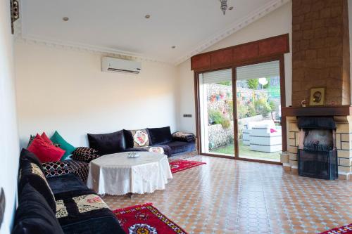 a living room with a couch and a table at Dar Zayane in Khenifra