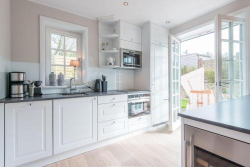 Dapur atau dapur kecil di Hoeoeg Hues Whg 1