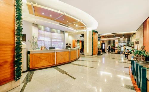 a lobby of a shopping mall with a counter at Greenhills Elan Hotel Modern - Newly Renovated in Manila
