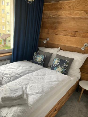 En eller flere senge i et værelse på Apartament Komorowskiego