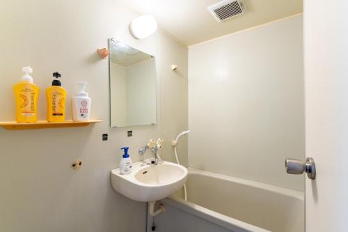 Ένα μπάνιο στο Type B Room 63平米 -ウル エスポワール石垣-