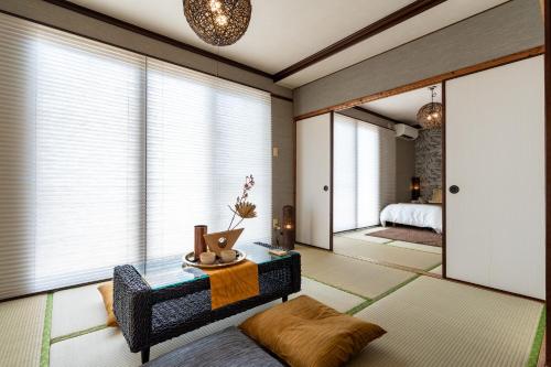 Ένα ή περισσότερα κρεβάτια σε δωμάτιο στο Type B Room 63平米 -ウル エスポワール石垣-