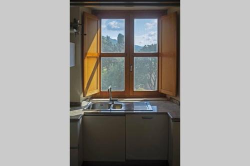 a kitchen with a sink and a window at Relax on the Sea in Pizzo