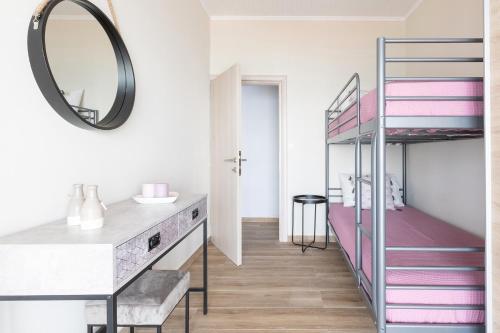 a bathroom with a bunk bed and a mirror at Villa Renata & Villa Filippos with private Plunge Pool by Konnect in Agios Gordios